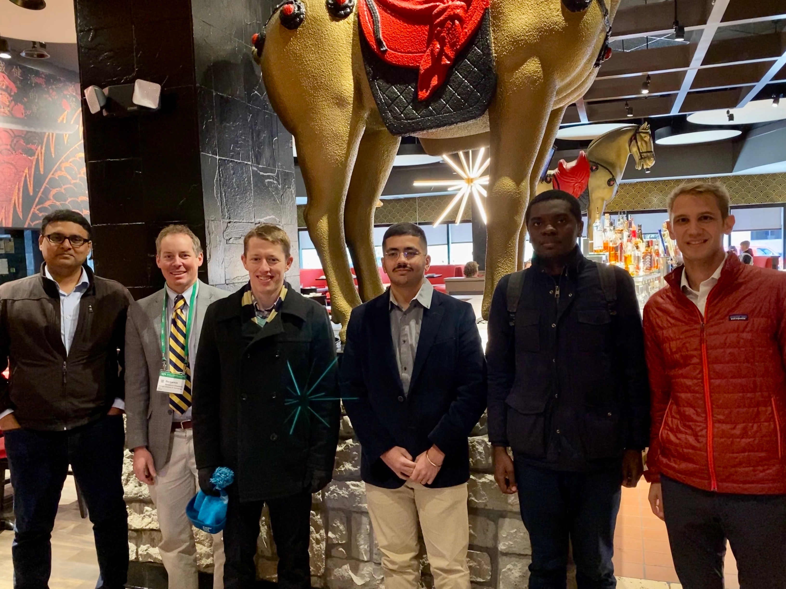 BTZ Researchers pose in front of PF Changs restaurant